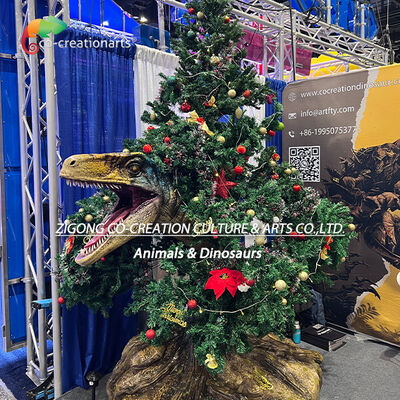 Comprar Dinosaurio rapaz animatrónico navideño con decoración de árboles para parques temáticos y eventos festivos Fabricación en línea